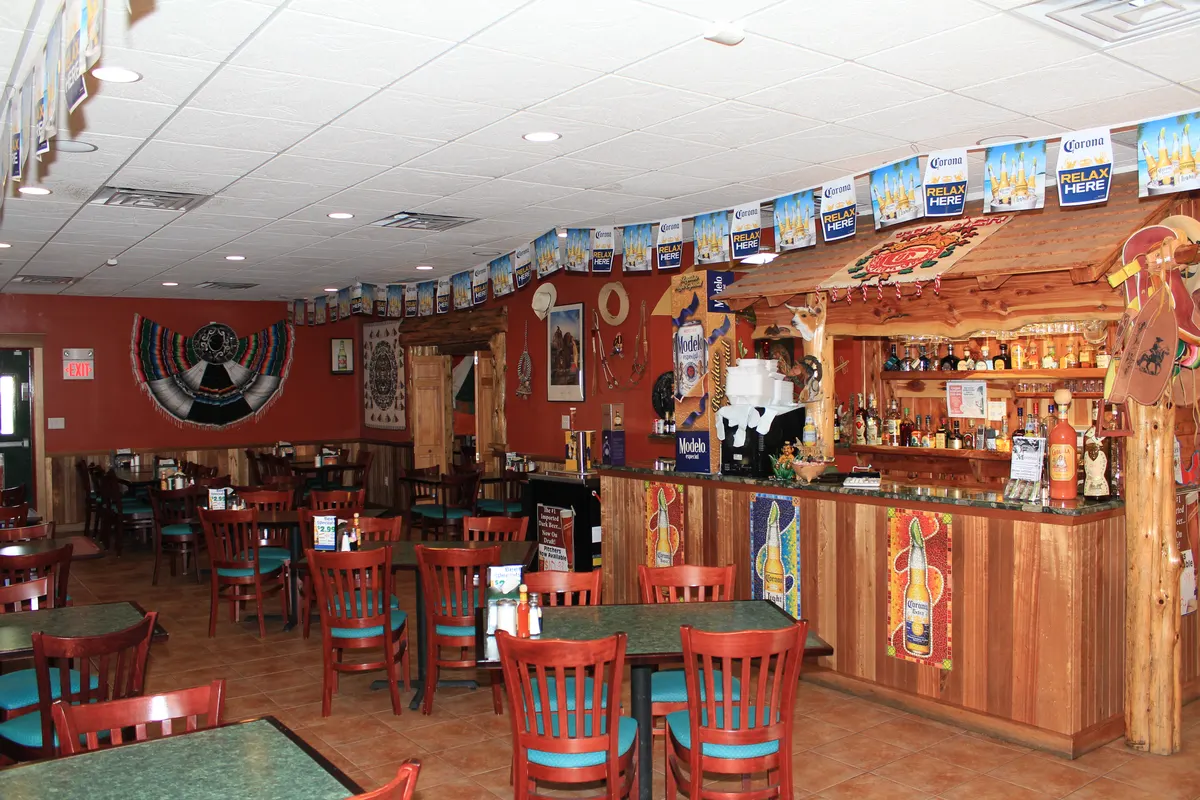 The wooden tequila bar and dining area at Fiesta Mexicana